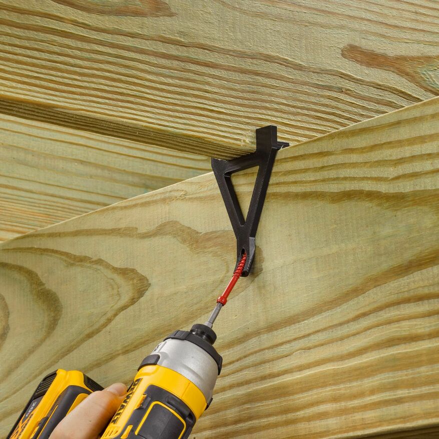 A professional is installing FastenMaster’s FrameFAST framing screw.