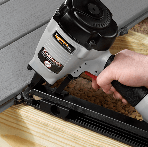 A Tiger Claw Installation Tool installs Tiger Claw Hidden Deck Clips.
