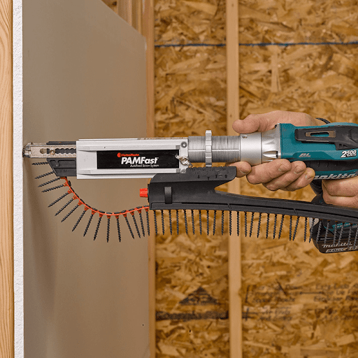A crew member is using the FastenMaster PAMfast system on a job site.